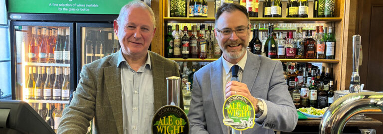 Bob Simpson of Powder Monkey Group and MP Richard Quigley pouring Ale of Wight in the House of Commons Strangers' Bar