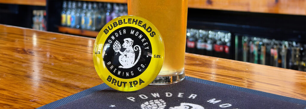 Pint of Bubbleheads Brut IPA beside the tap badge at The Powder Monkey Taphouse